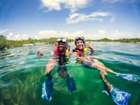 two people snorkling in the water