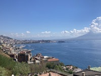 a view of the sea from a hillside in naples, italy