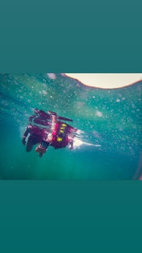 a person is swimming in the water with a snorkel